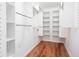 Walk-in closet with ample shelving and racks for organized storage at 5491 Hiram Rd, Powder Springs, GA 30127