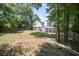 Large backyard features a deck, patio, and privacy fence at 990 Trestle Dr, Austell, GA 30106