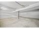 Spacious unfinished basement with white walls and concrete floor at 990 Trestle Dr, Austell, GA 30106