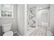 Bathroom showcasing a modern marble shower and updated fixtures at 990 Trestle Dr, Austell, GA 30106