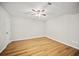 Bright bedroom features hardwood floors and a ceiling fan at 990 Trestle Dr, Austell, GA 30106