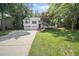 Charming two-story home with a well-manicured lawn and a two-car garage at 990 Trestle Dr, Austell, GA 30106
