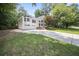 Beautifully landscaped front exterior with a driveway and two-car garage at 990 Trestle Dr, Austell, GA 30106