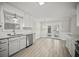 Updated kitchen with white cabinets, stainless steel appliances, and eat in nook at 990 Trestle Dr, Austell, GA 30106