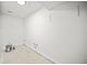 Unfinished room with white walls, concrete floor, and access to plumbing at 990 Trestle Dr, Austell, GA 30106