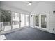 Enclosed porch area with ceiling fan and backyard view at 990 Trestle Dr, Austell, GA 30106