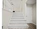 Carpeted staircase leading to the upper level of the home at 990 Trestle Dr, Austell, GA 30106