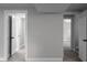 Finished basement hallway with access to rooms featuring gray carpet at 3267 Sunderland Dr, Snellville, GA 30039