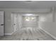 Bright basement with gray carpet and neutral paint, featuring natural light from two windows at 3267 Sunderland Dr, Snellville, GA 30039