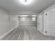 Bright basement with gray carpet and neutral paint, featuring natural light from two windows at 3267 Sunderland Dr, Snellville, GA 30039