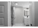 Bathroom featuring a new vanity and walk-in shower with tile surround at 3267 Sunderland Dr, Snellville, GA 30039