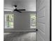 Cozy bedroom with gray carpet, ceiling fan, and natural light through large windows at 3267 Sunderland Dr, Snellville, GA 30039