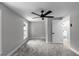 Bedroom featuring gray carpet, a ceiling fan, and natural light through a window at 3267 Sunderland Dr, Snellville, GA 30039