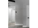 Bedroom with neutral gray walls, ceiling fan, gray carpet, and multiple doors at 3267 Sunderland Dr, Snellville, GA 30039