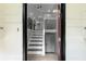 Bright foyer with staircase; features neutral wall colors, updated flooring and modern lighting at 3267 Sunderland Dr, Snellville, GA 30039