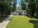 Charming two-story home with a well-maintained front yard and long driveway at 3267 Sunderland Dr, Snellville, GA 30039