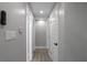 Bright hallway featuring hardwood floors and white doors at 3267 Sunderland Dr, Snellville, GA 30039