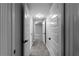 Hallway with gray carpeting and white doors offers access to rooms at 3267 Sunderland Dr, Snellville, GA 30039
