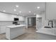 Contemporary kitchen boasts white cabinets, stainless appliances, and a functional center island at 3267 Sunderland Dr, Snellville, GA 30039
