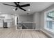 Bright, open living room with new flooring, modern ceiling fan and a spacious, airy feel at 3267 Sunderland Dr, Snellville, GA 30039