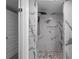 Walk-in shower with a tile surround and a pebble floor design at 3267 Sunderland Dr, Snellville, GA 30039