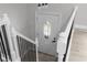 Upstairs hallway featuring fresh paint, new floors and decorative lighting at 3267 Sunderland Dr, Snellville, GA 30039