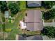 Expansive backyard featuring a patio, lush lawn, manicured landscaping, storage shed, and privacy fence at 3370 Battlement Cir, Loganville, GA 30052