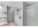 Modern bathroom features a soaking tub, glass shower, granite double vanity, and tile flooring at 3370 Battlement Cir, Loganville, GA 30052