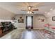 Spacious bonus room with a desk, table, and custom bar offers flexible living and entertainment at 3370 Battlement Cir, Loganville, GA 30052