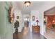 Inviting foyer featuring hardwood floors, a decorative table, and views into adjacent rooms at 3370 Battlement Cir, Loganville, GA 30052
