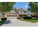 Charming two-story home with a brick facade, manicured lawn, and attached two-car garage at 3370 Battlement Cir, Loganville, GA 30052