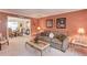 Comfortable living room with neutral decor, plush sofa, and access to the dining room at 3370 Battlement Cir, Loganville, GA 30052