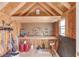 Interior of a well-organized shed featuring a workbench, storage, and ample space for tools and equipment at 3370 Battlement Cir, Loganville, GA 30052