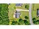 An aerial view showing a well-maintained home with a long driveway and spacious, green lawn at 4167 Alayna Lee Cir, Mcdonough, GA 30252