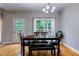 Cozy dining area with wood floors and a view of the backyard at 4167 Alayna Lee Cir, Mcdonough, GA 30252