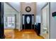 Bright foyer featuring a high ceiling, hardwood floors, and a modern design at 4167 Alayna Lee Cir, Mcdonough, GA 30252