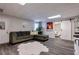 Cozy living room featuring a comfortable sectional sofa, stylish flooring, and a barn door at 4167 Alayna Lee Cir, Mcdonough, GA 30252