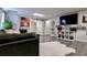 Stylish living room with modern decor, shelving, and a large TV, perfect for entertaining and relaxing at 4167 Alayna Lee Cir, Mcdonough, GA 30252