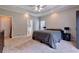 Spacious carpeted main bedroom featuring a tray ceiling at 4167 Alayna Lee Cir, Mcdonough, GA 30252