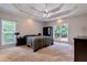Spacious main bedroom featuring a tray ceiling and large windows at 4167 Alayna Lee Cir, Mcdonough, GA 30252