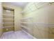 Walk-in closet provides ample storage with wire shelving on all sides, great for organization at 240 Chandler Walk, Loganville, GA 30052