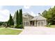 Craftsman-style home with a side-entry garage and manicured front lawn at 240 Chandler Walk, Loganville, GA 30052