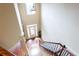 Bright foyer with hardwood floors, staircase, and transom window at 240 Chandler Walk, Loganville, GA 30052