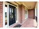 Welcoming front door with decorative brickwork and covered entry at 240 Chandler Walk, Loganville, GA 30052