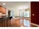 Kitchen with granite countertops and stainless appliances and adjoining breakfast room at 240 Chandler Walk, Loganville, GA 30052