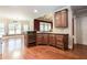 Open concept kitchen with stainless appliances, granite countertops, and an eat-in breakfast area at 240 Chandler Walk, Loganville, GA 30052