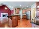 Open kitchen with stainless steel appliances, granite counters, and a large island at 240 Chandler Walk, Loganville, GA 30052