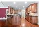 Kitchen with custom cabinetry, granite countertops, and stainless steel appliances at 240 Chandler Walk, Loganville, GA 30052