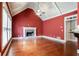 Bright living room features a fireplace, hardwood flooring, and plenty of natural light at 240 Chandler Walk, Loganville, GA 30052