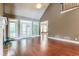 Bright living room featuring hardwood floors, French doors, and plenty of natural light at 240 Chandler Walk, Loganville, GA 30052